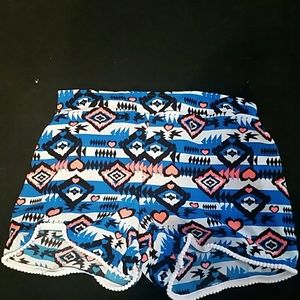Blue fabric shorts with cool patterns on them